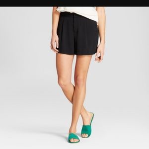 Black pleated shorts